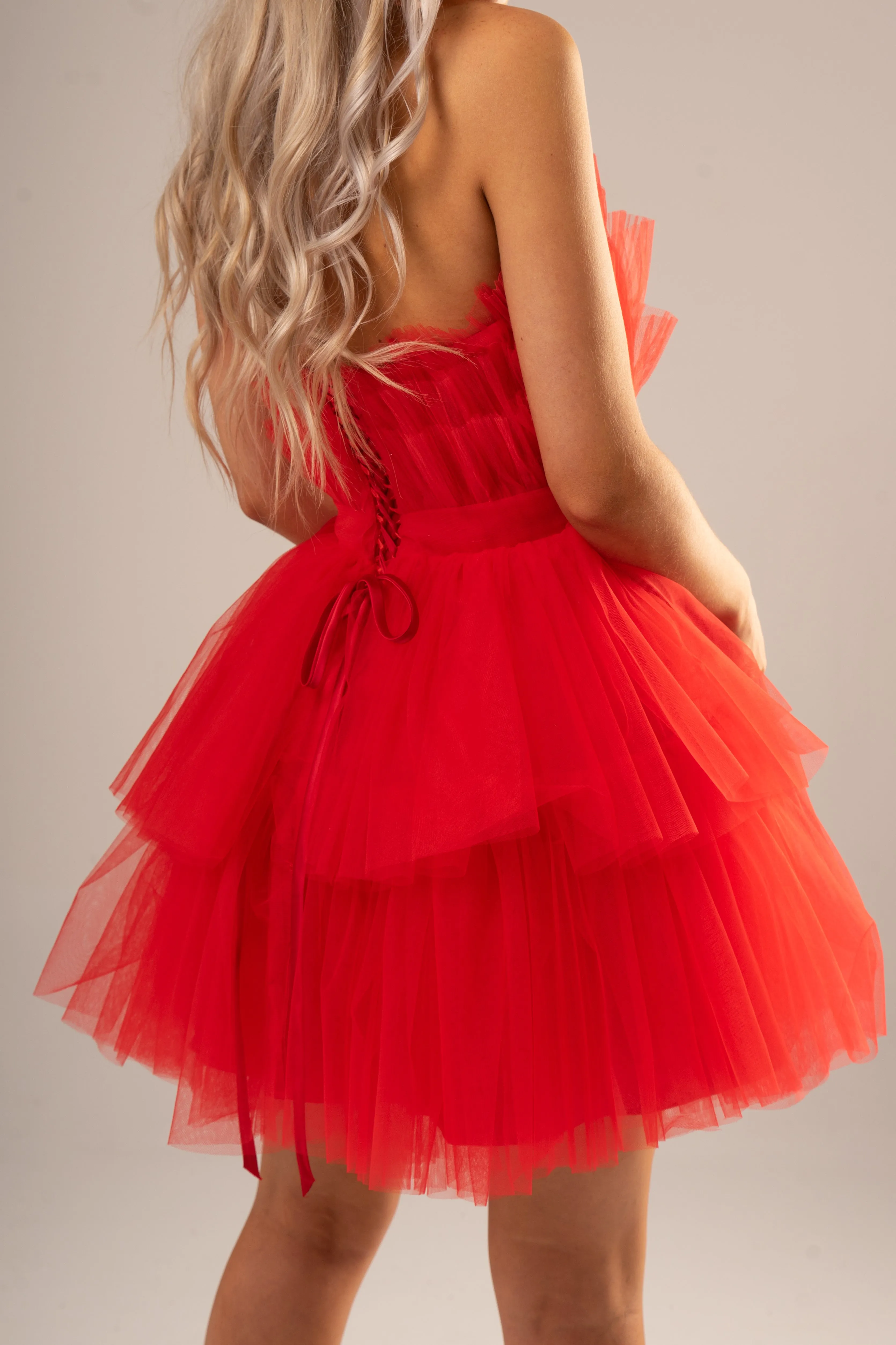 Red pleated layered high and low tulle dress for hire